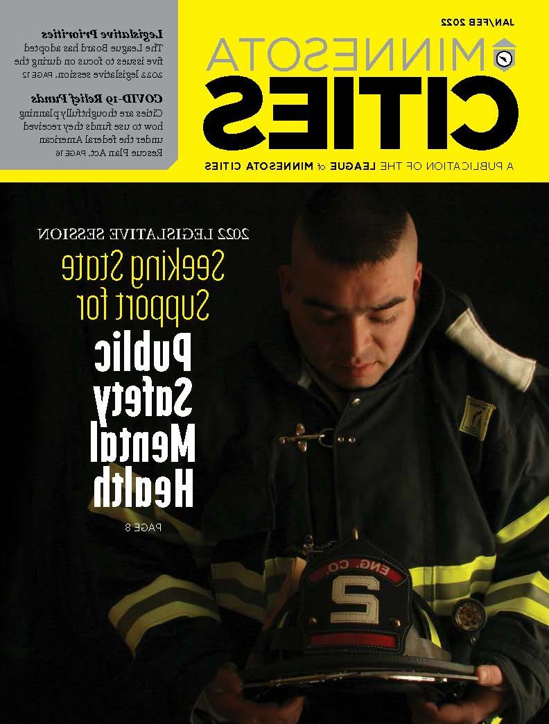 《MN Cities》杂志的封面是一个看起来很沮丧的消防员.